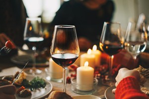 Sex lessons Christmas Red wine glasses at the decorated dinner table