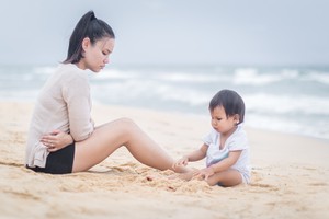 Stressed and exhausted mother suffering from postpardum depression